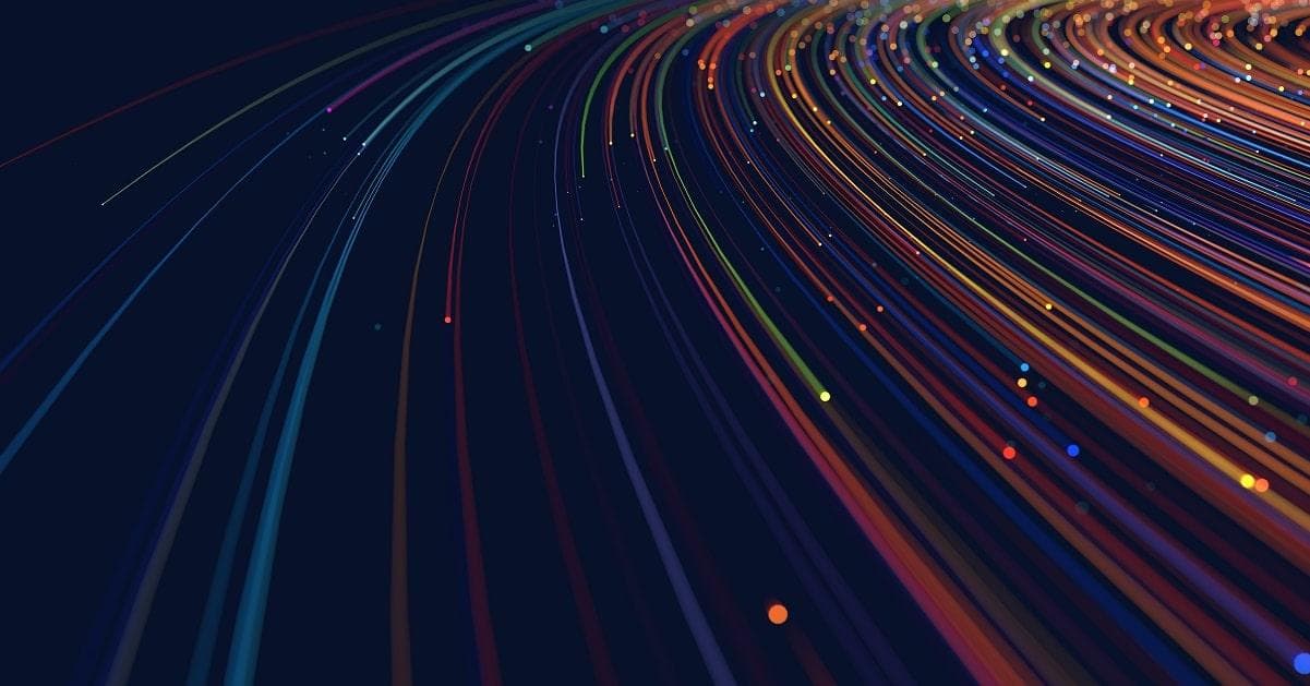 Sweeping curved streaks of multicolored light against a dark navy background — a fiber-optic / data-flow abstract suggesting structured, directional movement through a system.